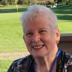Smiling headshot of Sheila Mesick.